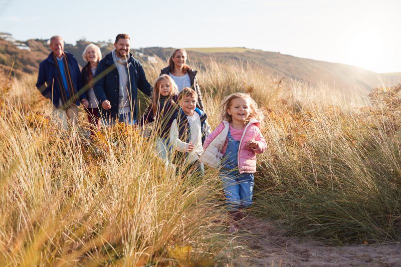 Family on a beach in Wales in autumn