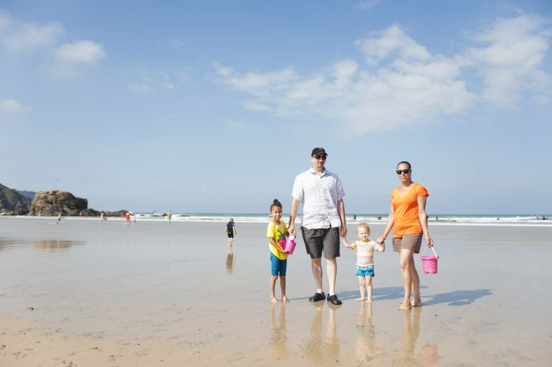 A family on Perranporth beach